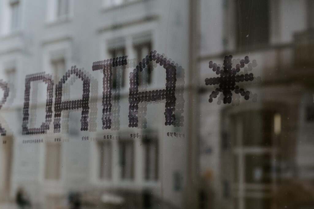 A photo of the word "DATA" on a window